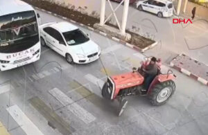 Sigarasını söndürüp trafiğin ortasında traktörle drift attı