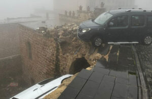 Mardin’de sağanak sonrası felaket! Yol çöktü 2 araba evin içine düştü